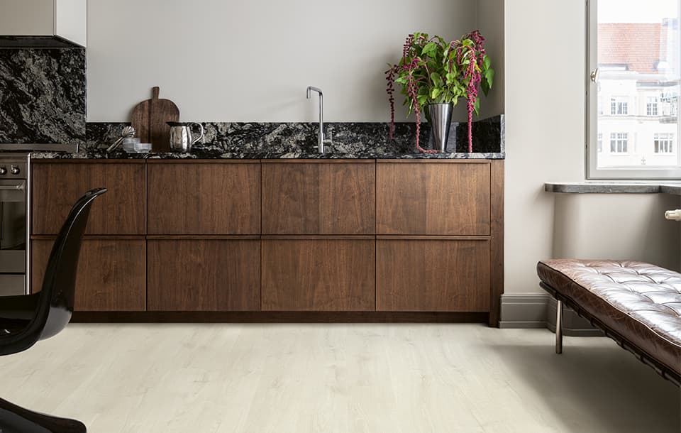 brown kitchen with a grey laminate floor